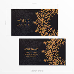 Preparing business cards in luxury black with vintage ornaments. Template for print design business card with mandala patterns.