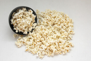 Natural popcorn with natural corn in a container or paper bag ready for a movie

