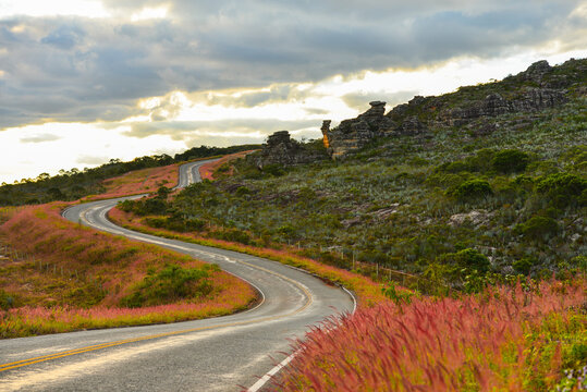 Sunset on the winding mountain road through the rocky landscape of the Serra do Espinha&ccedil;o range, between the towns of Serro and Milho Verde, Minas Gerais, Brazil