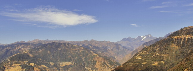 beautiful mountainscape and snowcapped peak, blue sky in the background in summertime, tawang in arunachal pradesh in india