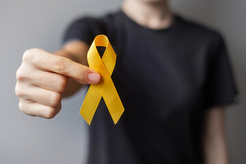 Suicide prevention day, Sarcoma, bone, bladder and Childhood cancer Awareness month, Yellow Ribbon for supporting people living and illness. children Healthcare and World cancer day concept - obrazy, fototapety, plakaty