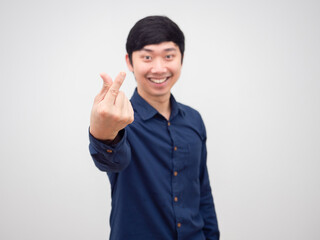Cheerful man asian show hand mini heart on white background