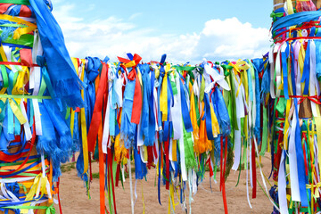 Hitching posts with ribbons of shamanism religion in Khuzhir, island Olkhon. 