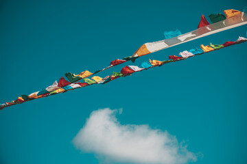 Tibetan prayer flags background blue sky