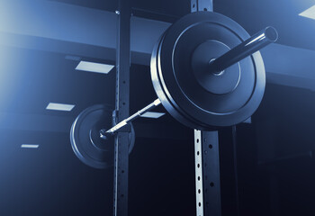 Fototapeta A barbell for training an athlete in the gym. Dark background. obraz