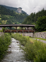 Old wooden bridge with flowers in Matrei in Osttirol