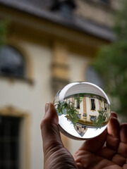 Church St Alban in Matrei in Osttirol through a glass sphere