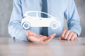 Digital composite of Man holding car icon.Car automobile insurance and car services concept....