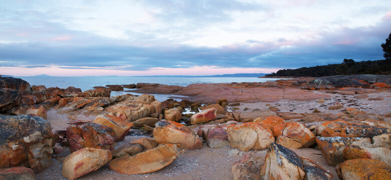 sunrise over rocky beach