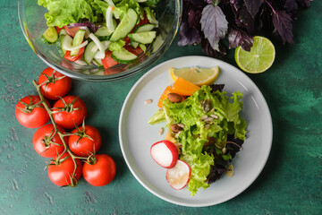 Composition with tasty fresh salad on color background