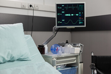 Respiratory mask with resuscitator for ventilation of patient. Interior of hospital room with nobody in it. Comfortable bed for sick people during recovery and getting treatment.