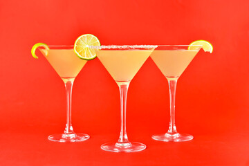Glasses with tasty daiquiri cocktail on color background