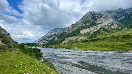 Naklejka na ściany i meble Amazing nature of North Ossetia, Russia. Impenetrable rocks, majestic mountains, mountain river.