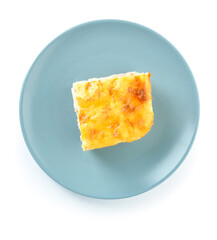 Plate with piece of mashed potato casserole on white background
