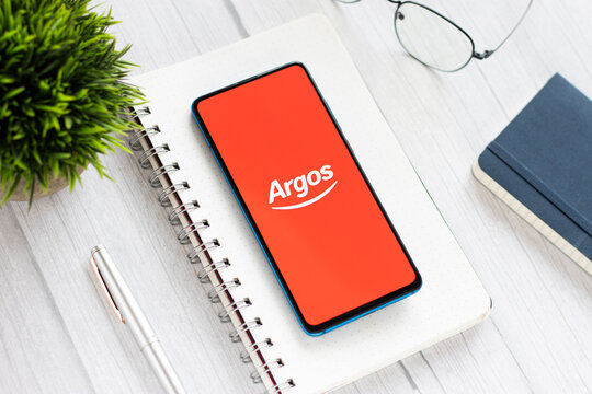 Assam, india - May 18, 2021 : Argos logo on phone screen stock image.