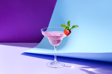 Glass of tasty cosmopolitan cocktail on color background