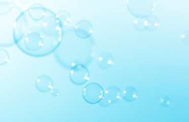 Fototapeta na wymiar Blue Transparent Soap Bubbles Background.