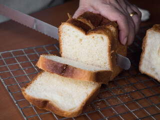 Slicing bread loaf into square pieces