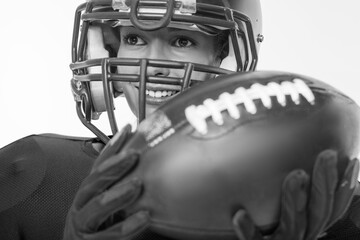 Black and white images of a sports girl in the uniform of an American football team player. Sports...