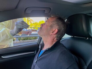 PCR nose swab for covid 19 in drive through testing clinic