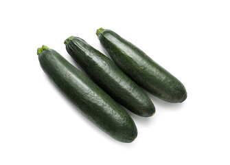 Fresh zucchini squashes on white background
