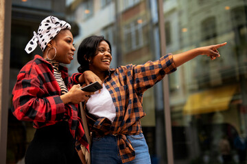 Portrait of a happy smiling female friends. Women laughing and having fun outdoors