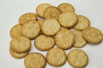 top view of salty round cookies on white background