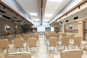 Interior of a empty hotel seminar room with chairs in a row