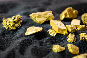 Pure gold from the mine that was unearthed was placed on the black sand.