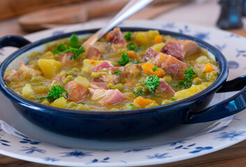 Pea stew or pea soup with pork belly and sausages