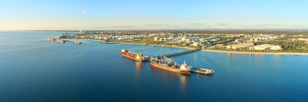 horizontal shot of Kwinana bulk jetty with two large ships docked at the port