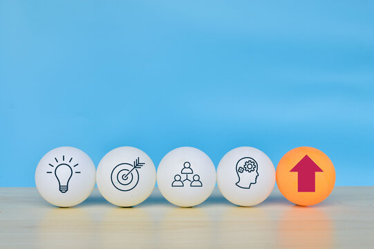 Table tennis ball with light bulb, target, teamwork, human and arrow symbol. Business strategy and action plan concept.