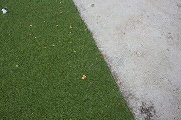 Obraz premium green artificial grass as a rough floor covering