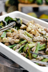 mixed battered okra and cauliflower vegetable tempura in buffet tray