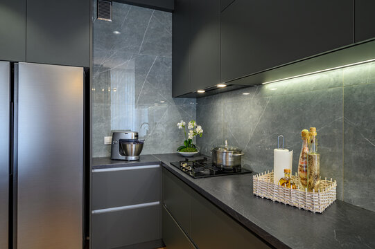 Modern large luxury dark gray kitchen closeup