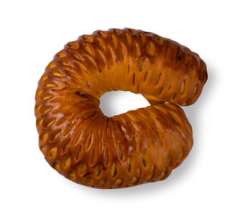 Rich sweet bun isolated on a white background.Fresh horseshoe-shaped pastries with poppy seed...