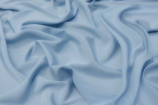 Fabric viscose (rayon). Color is light blue. Texture, background, pattern