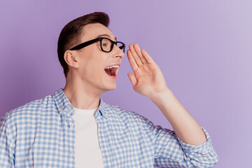 Portrait of funny announcer guy hand open mouth look sceram blank space share message on purple...