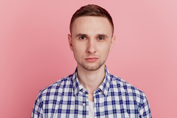 Close-up portrait of serious successful smart clever intelligent brunette guy isolated over pink color pastel background