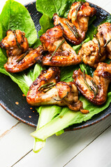 BBQ Chicken Wings on lettuce leaves