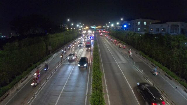 Time lapse busy traffic in Thu Thiem tunnel exit. This is an economic transport project across the Saigon river in Ho Chi Minh City, Vietnam