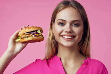 cute cheerful woman in pink shirt hamburger food diet