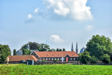 Fototapeta na wymiar Beautiful views over the village of Uden with its Birgittinessen monastery and the St Peter's Church. Netherlands, Holland, Europe