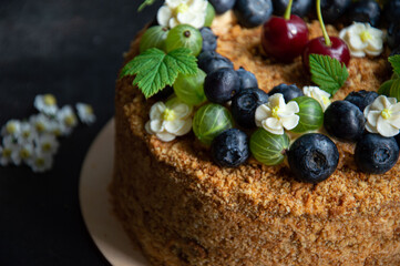 A beautiful and bright cake on a dark background.