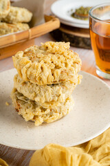 Gandasturi or kue kacang ijo. a cake from indonesia made from green beans and brown sugar, shaped round and flat, coated with flour and then fried.