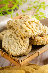 Gandasturi or kue kacang ijo. a cake from indonesia made from green beans and brown sugar, shaped round and flat, coated with flour and then fried.