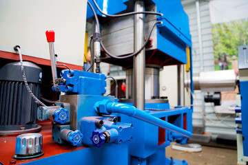 Close up heavy industrial machinery in a plastic recycling factory