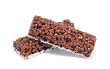 Cereal chocolate bar or muesli snack made from puffed cornes pressed with caramel isolated on white