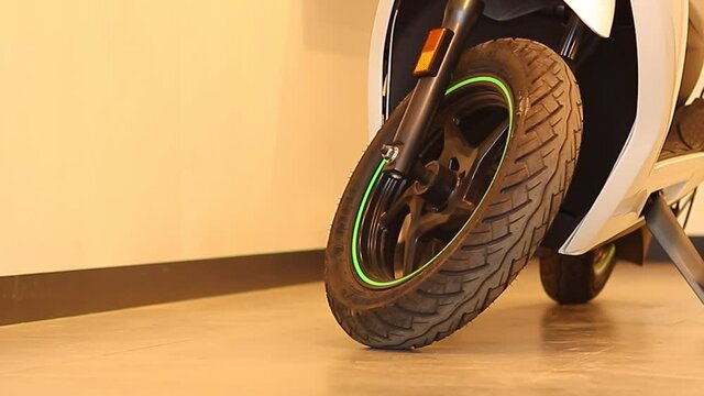 Wide shot of a two Wheler tyer