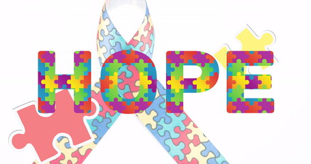 Image of hope text over ribbon formed with puzzles on white background